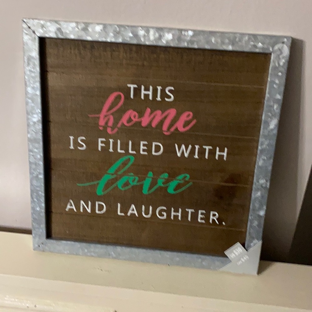 Decorative sign 
“This home is filled with love and laughter “